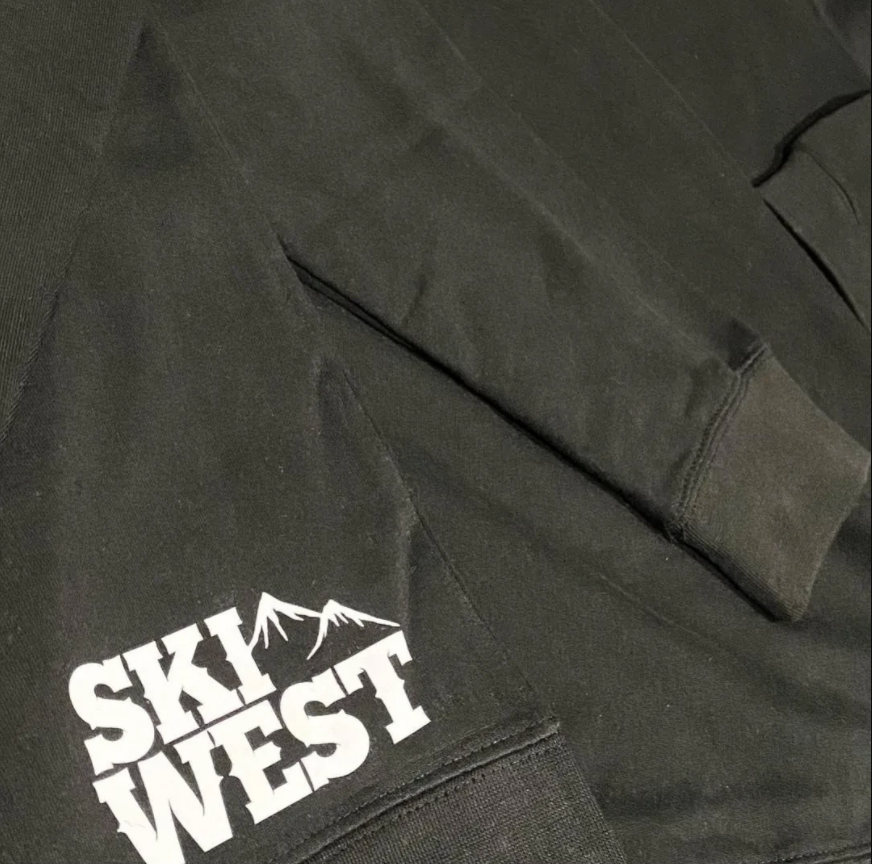 Black hoodie with 'Ski West' logo on a dark background