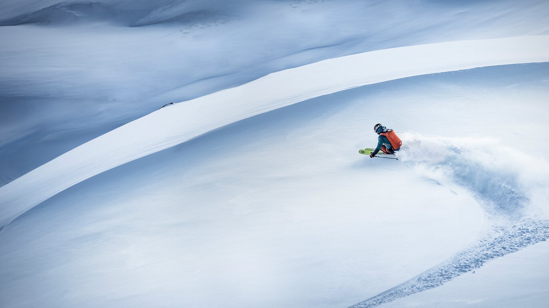 Skier freeriding big mountain terrain