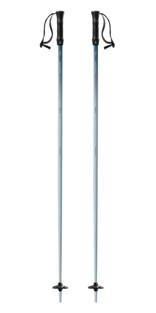 A pair of Atomic ski poles with metallic silver shafts and black handles, shown vertically against a plain white background.